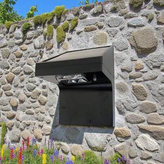 Solar-powered wall light